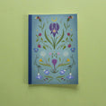 Load image into Gallery viewer, Notebook with floral design on a green background
