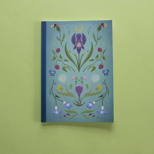 Notebook with floral design on a green background