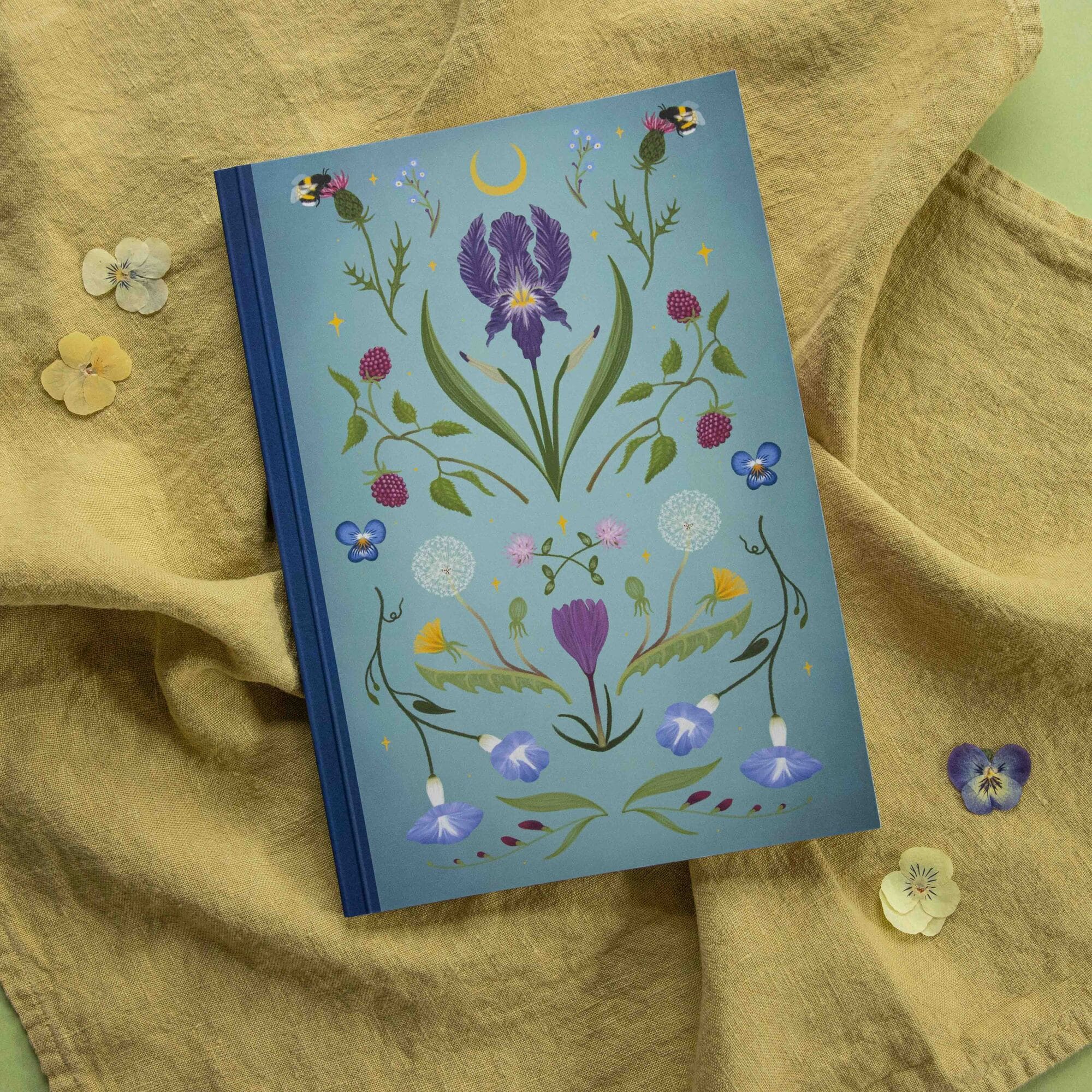 Notebook with floral design on a textured fabric background