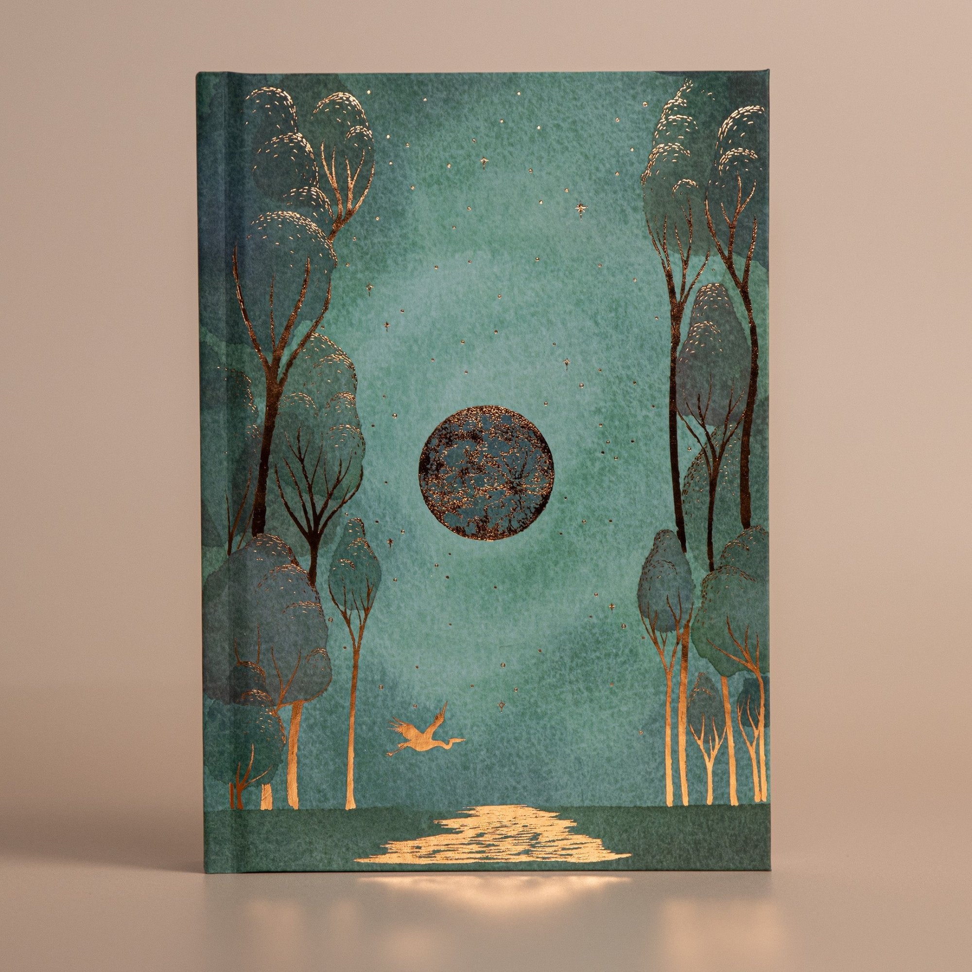 Front of the moon journal 2025 in green with gold outlines