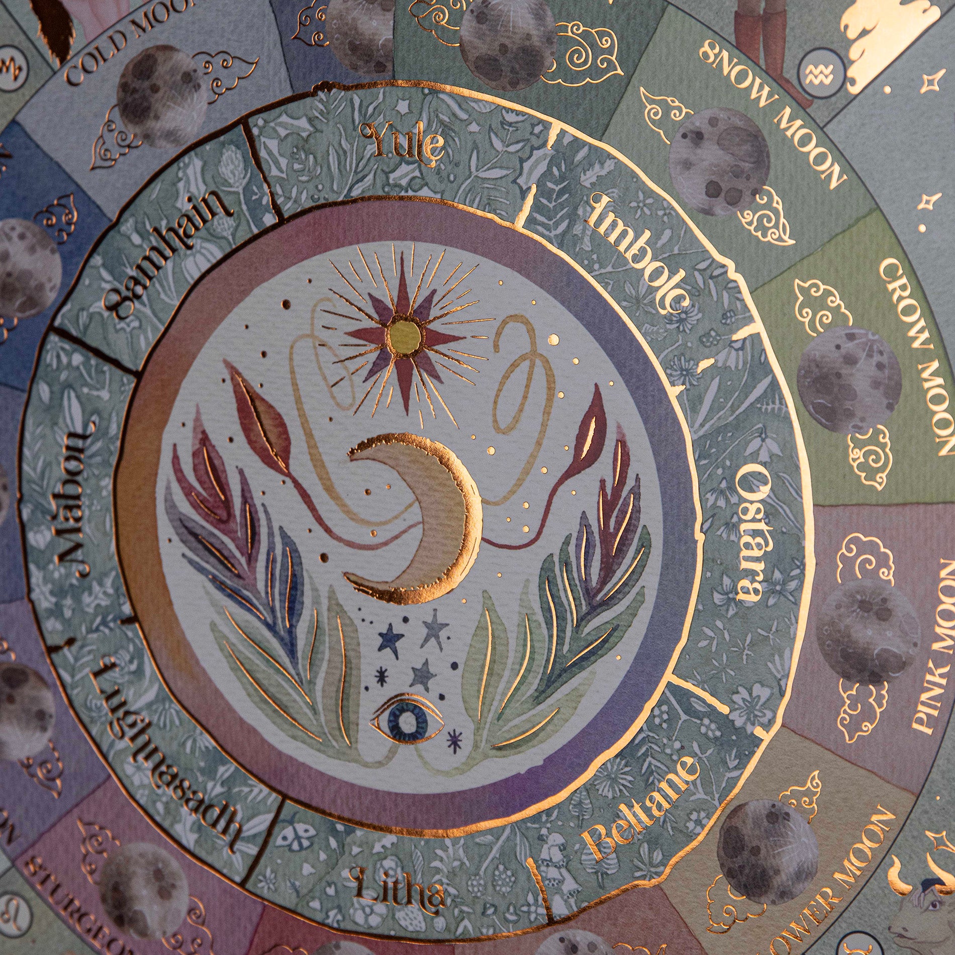 showing the center of the moon phase calendar 2025 with lots of details with gold leaf details
